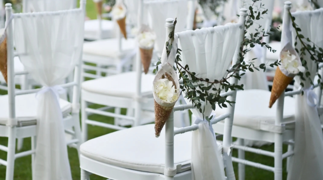 Big Dawg Party Rentals online catalog featuring white wedding chairs with elegant décor for premium event rentals