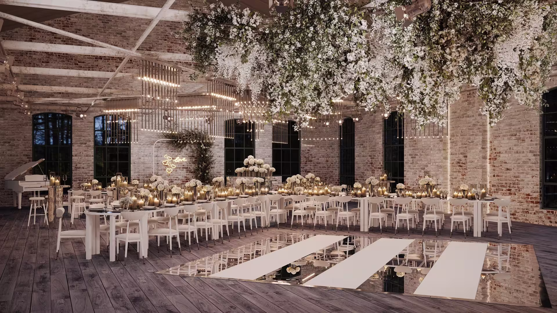 Industrial-style wedding reception with long tables, white chairs, hanging greenery, and warm ambient lighting